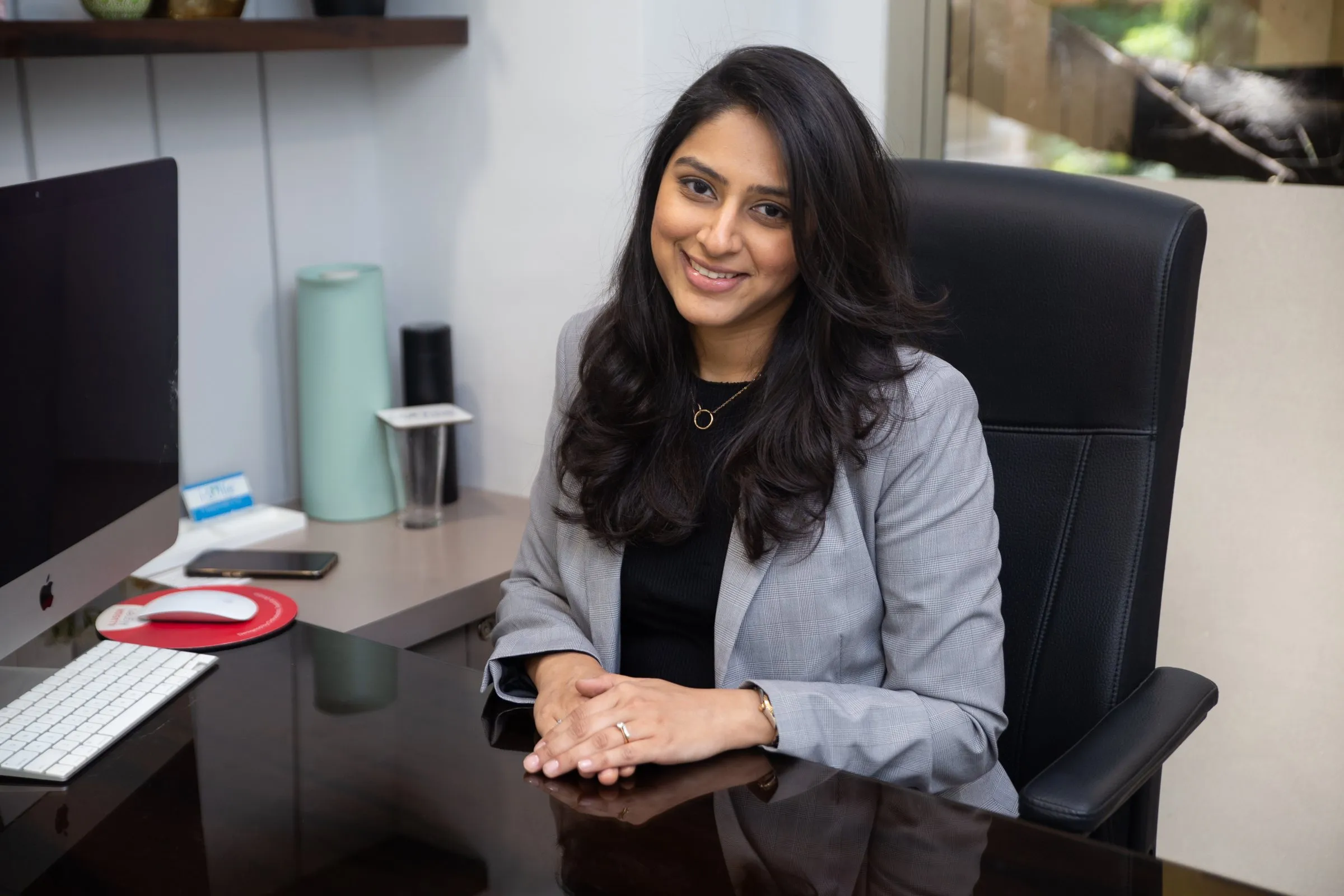 Dr. Upasana Gosalia at her desk at i-Smile Dental Clinic, Ghatkopar East