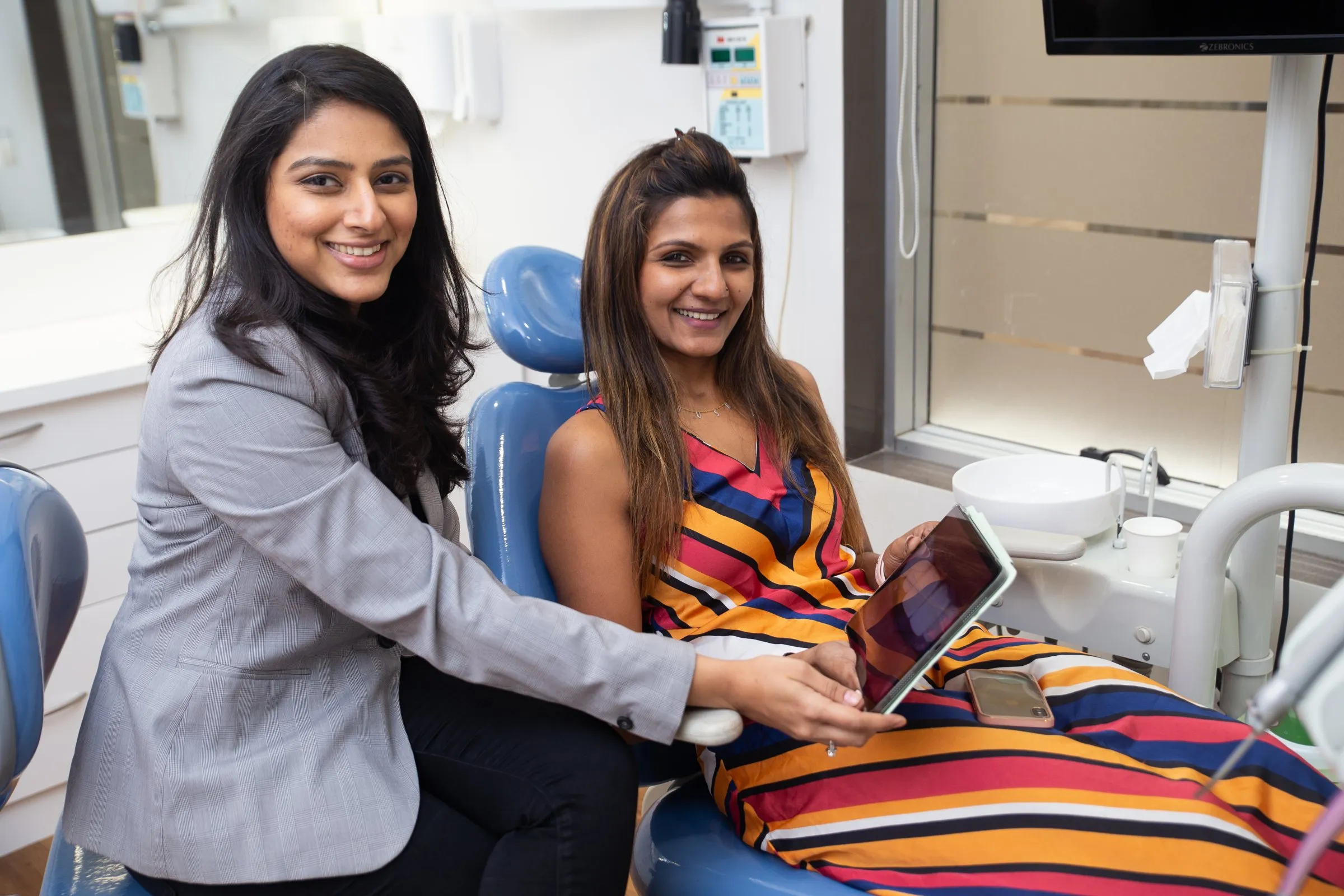Dr. Upasana Gosalia with a smiling patient in the treatment chair at i-Smile, Ghatkopar East